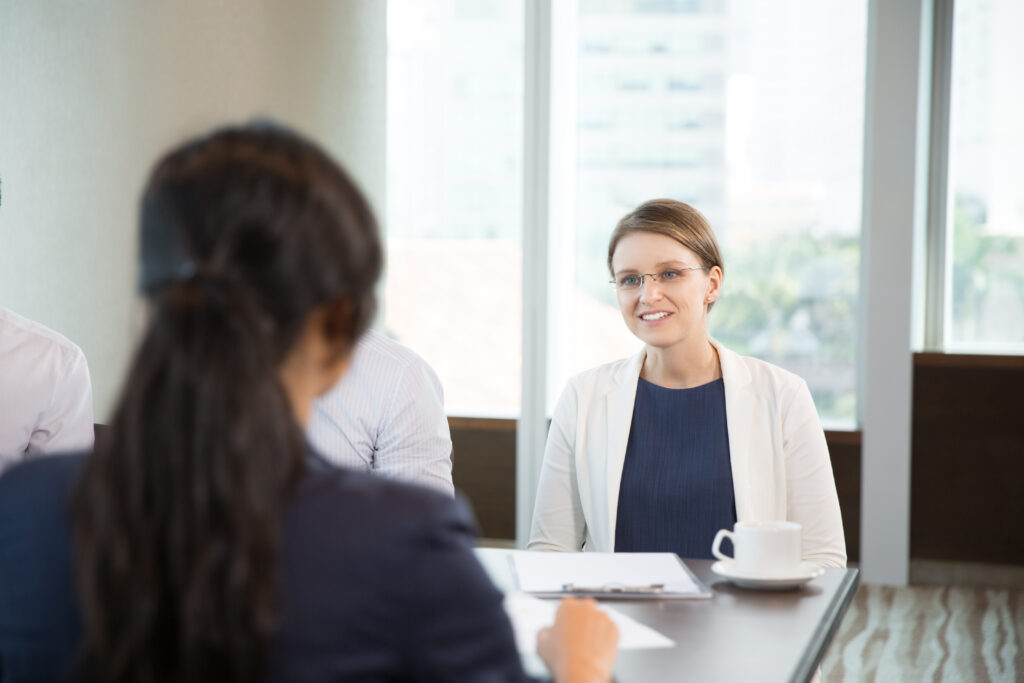 businesswoman talking female colleague