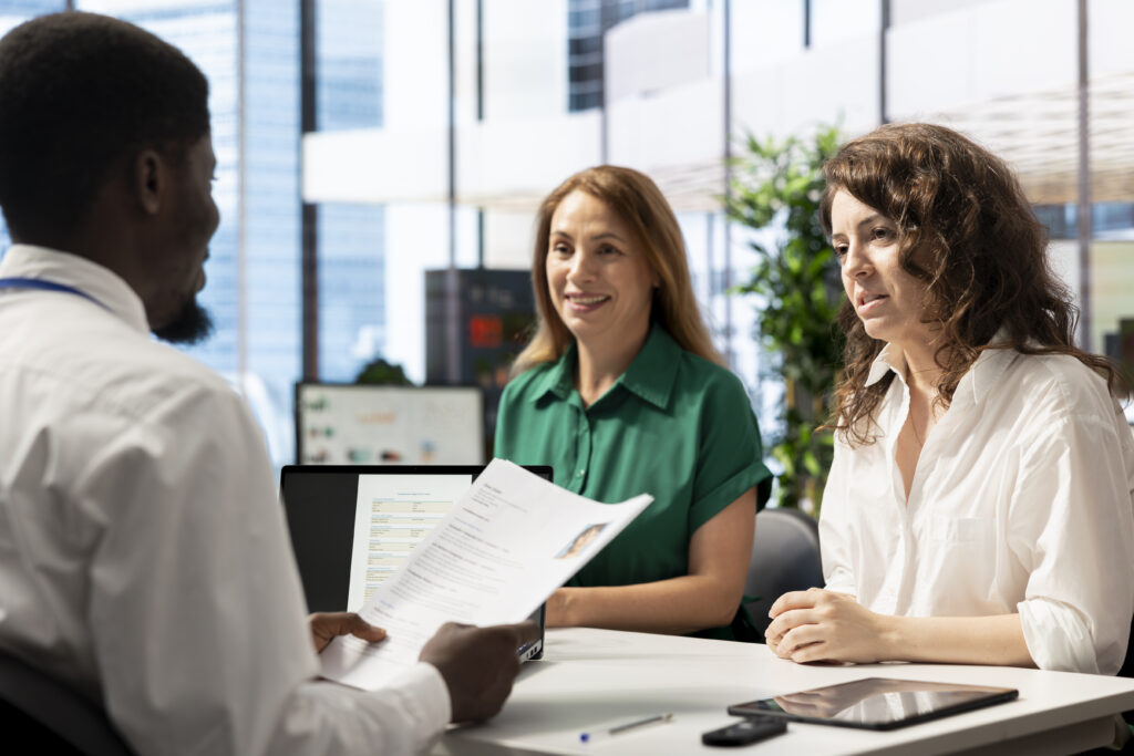cheerful hr managers asking interview questions vet applicants